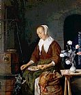 Gabriel Metsu Famous Paintings - Woman Eating and Feeding her Cat
